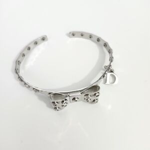 DIOR DIOR DIOR COUTURE RARE Silver Bow Cuff with Stud Accents and DIOR marked D